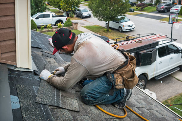 Professional Roofing technician working in Center, TX